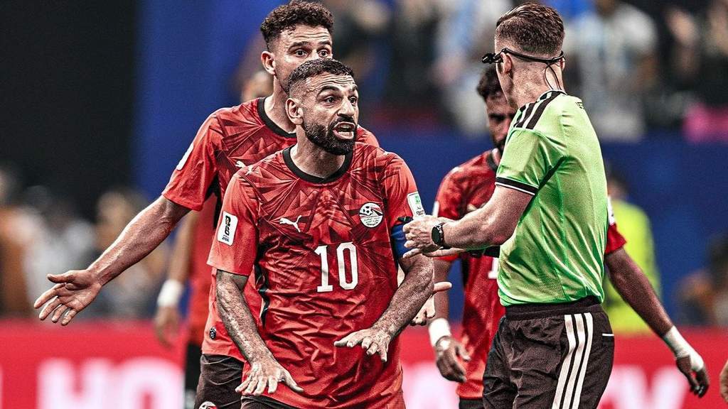 Egyptian national football team players protesting a referee decision during the World Cup