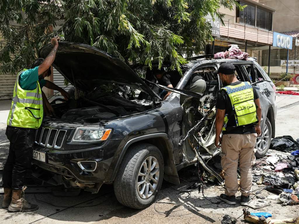 The aftermath of an Israeli drone attack targeting a car in southern Lebanon.