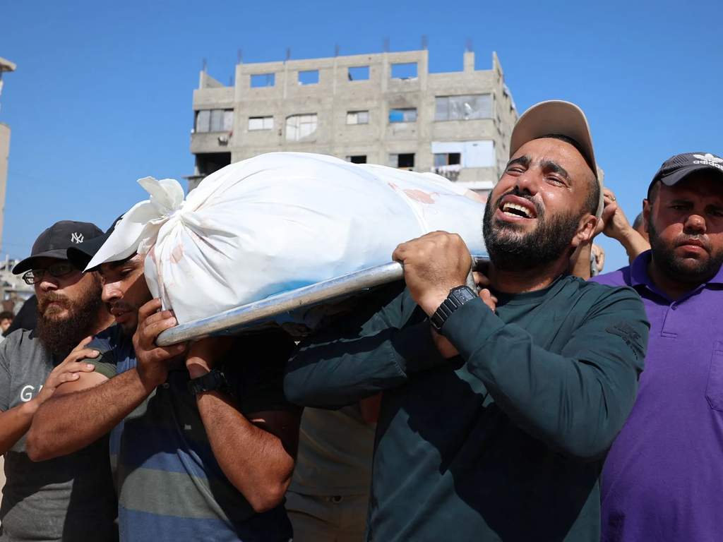 Smoke rises from buildings in Gaza following recent military strikes