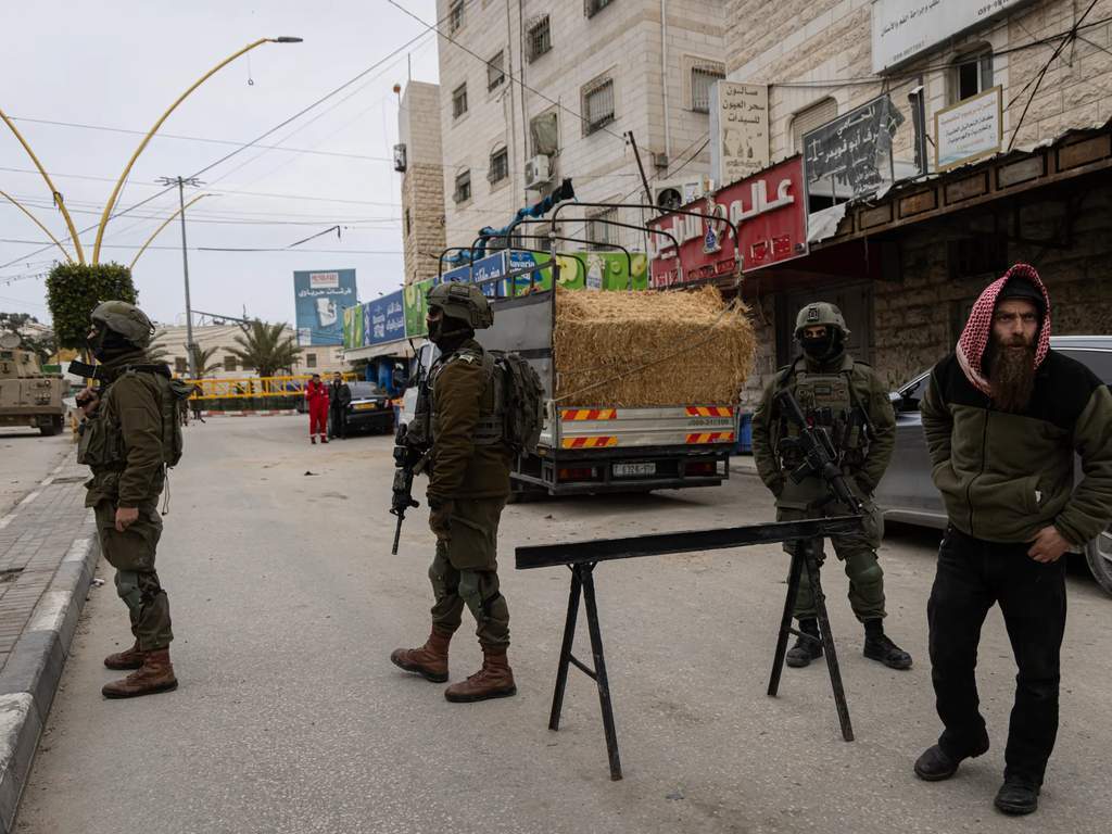 A military checkpoint in the occupied West Bank restricting movement.