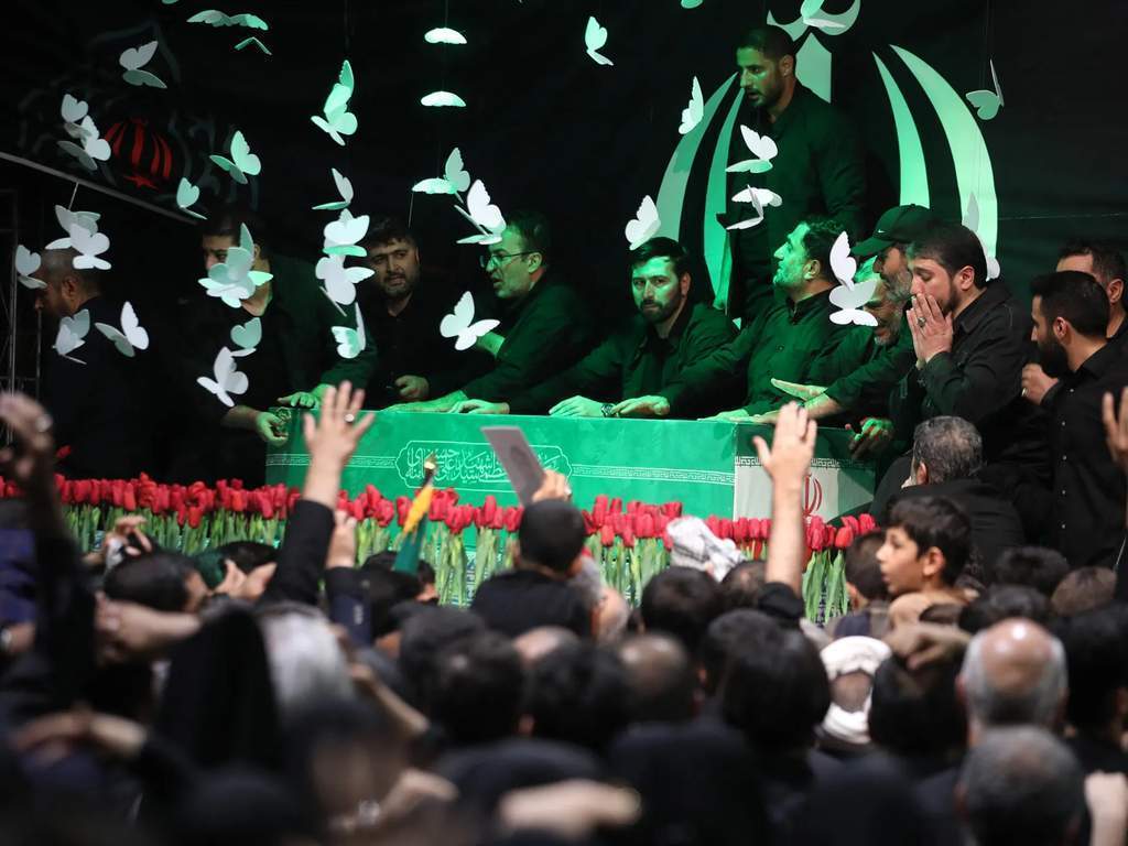 Banners showing a clenched fist at Khamenei's funeral in Tehran.