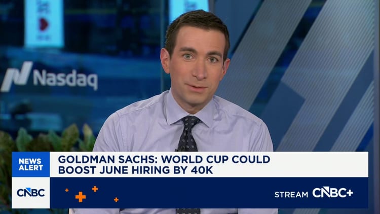 A crowded stadium during a World Cup match symbolizing the economic boost to jobs
