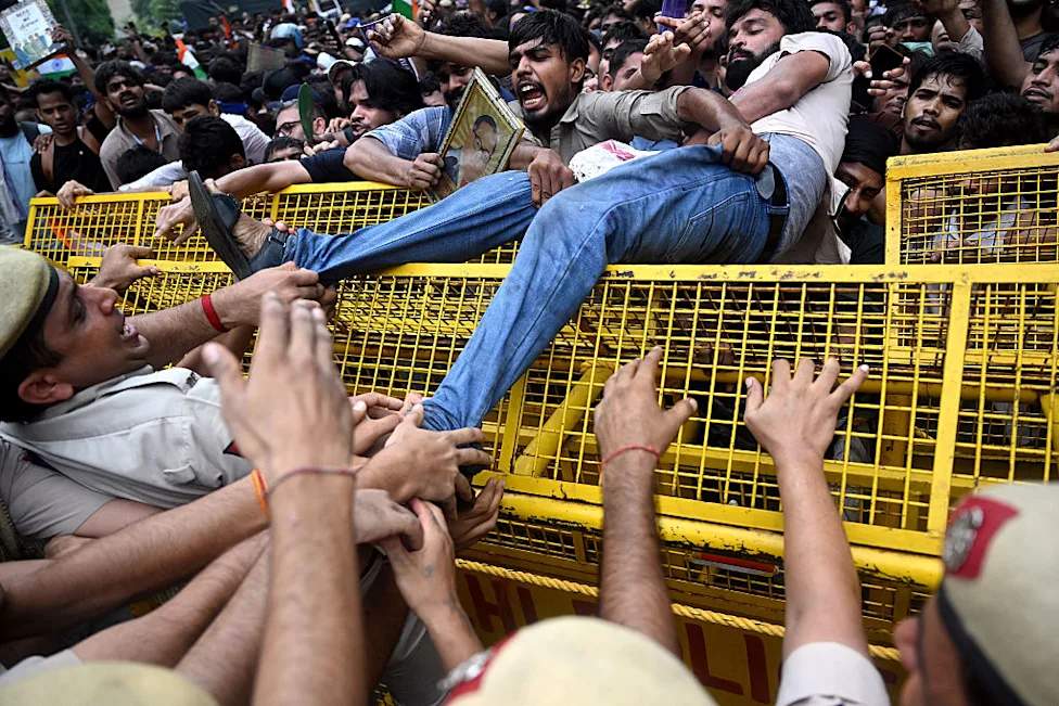 Cockroach Janta Party demonstrators protest in India against education minister Dharmendra Pradhan